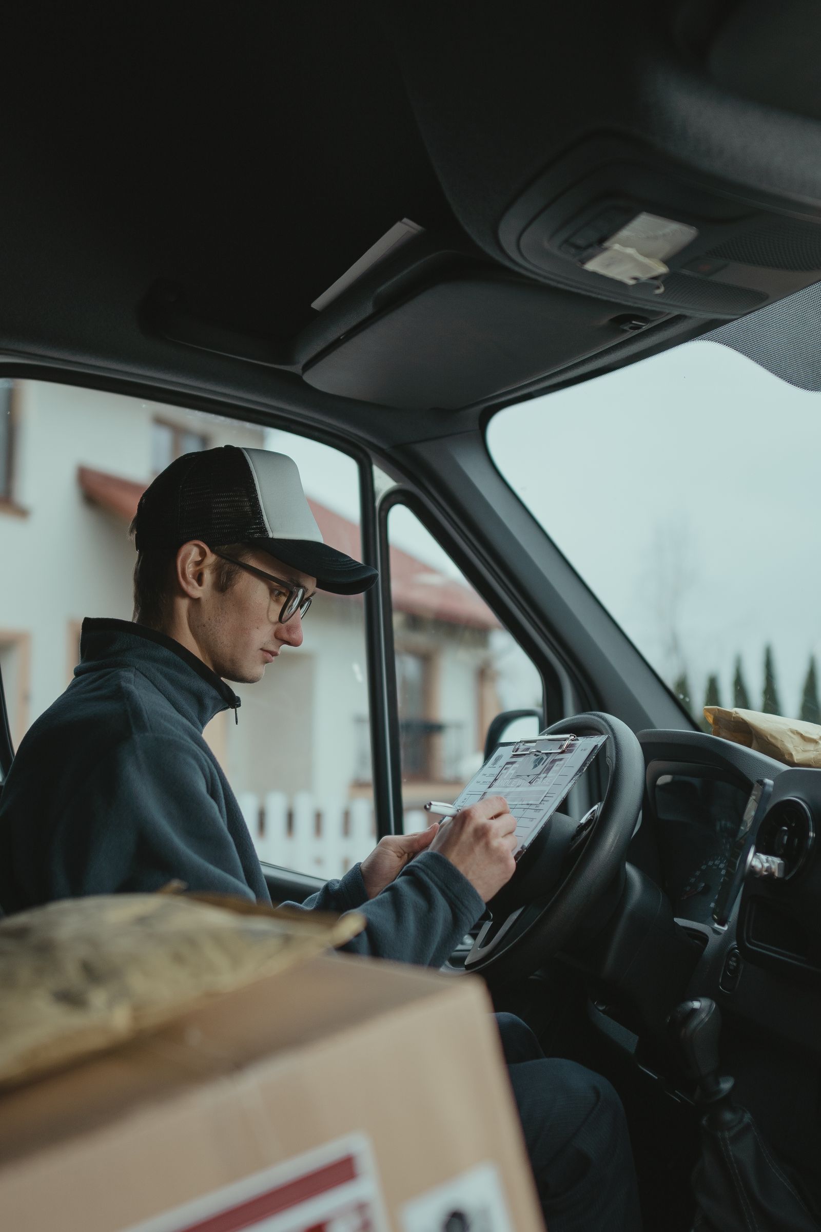 B&N driver reviewing a delivery manifest before a route